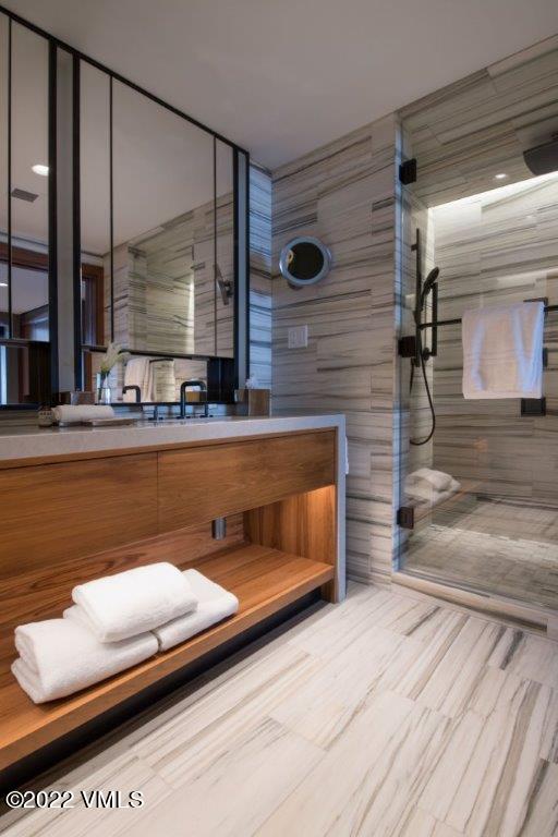 1 Vail Road, Unit 6103 Vail, CO 81657 - Photo 16 of 26 a bathroom with a sink and a mirror