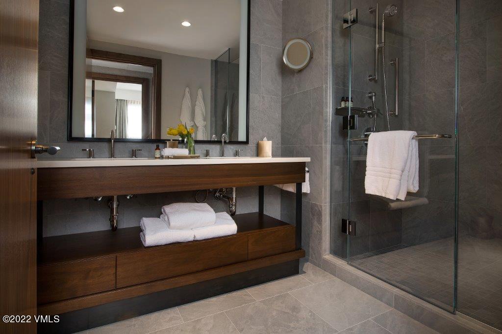 1 Vail Road, Unit 6103 Vail, CO 81657 - Photo 19 of 26 a bathroom with a sink and a mirror