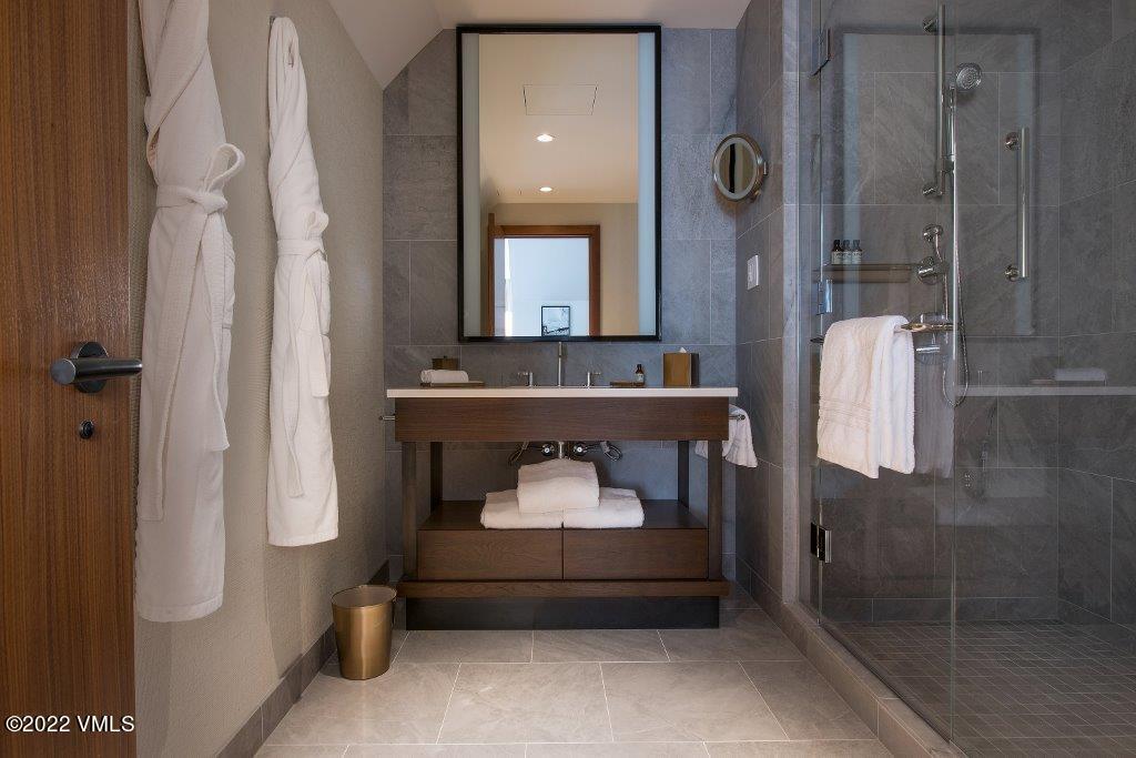 1 Vail Road, Unit 6103 Vail, CO 81657 - Photo 20 of 26 a bathroom with a sink and mirror