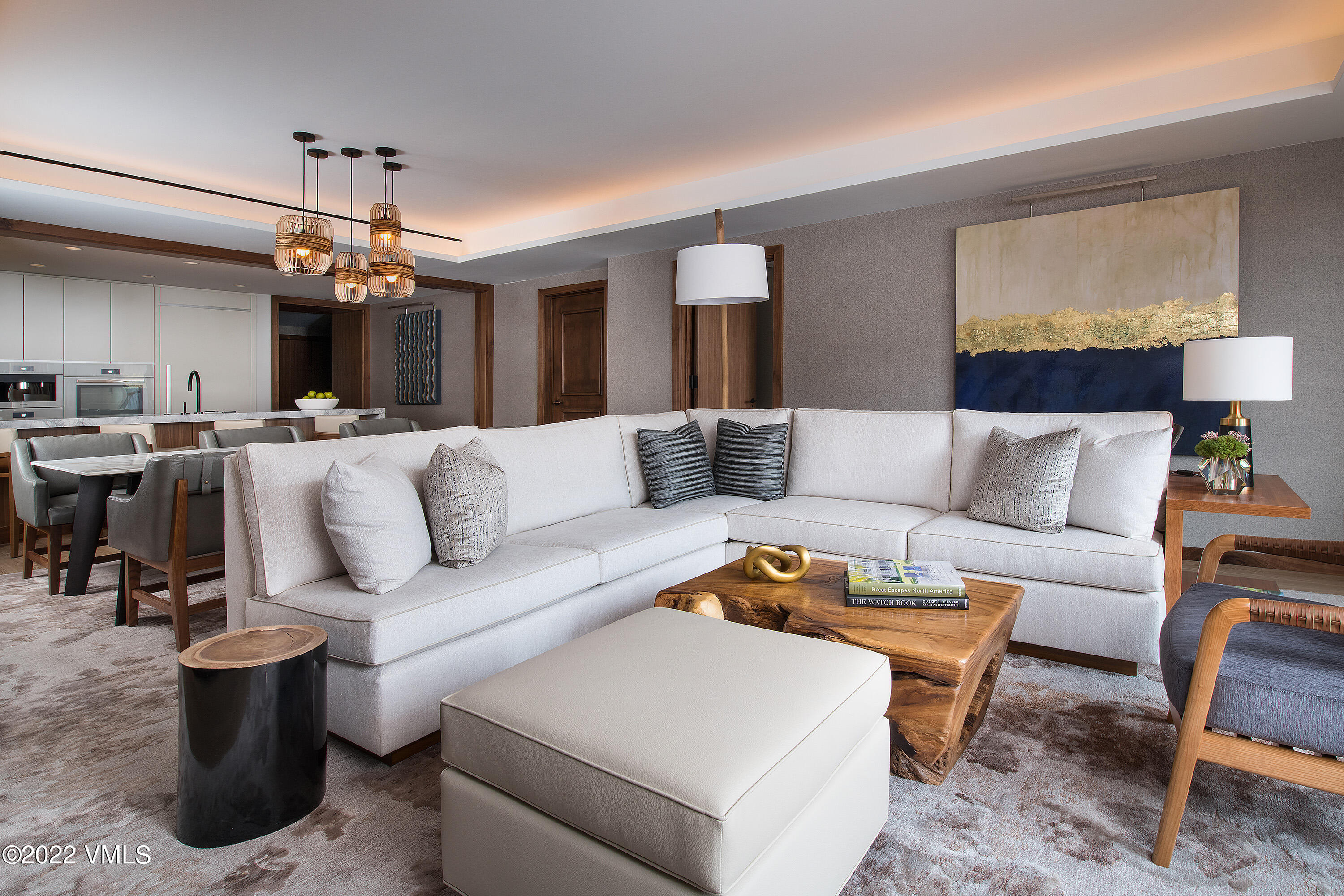 1 Vail Road, Unit 6103 Vail, CO 81657 - Photo 3 of 26 a living room with furniture a chandelier and a dining table