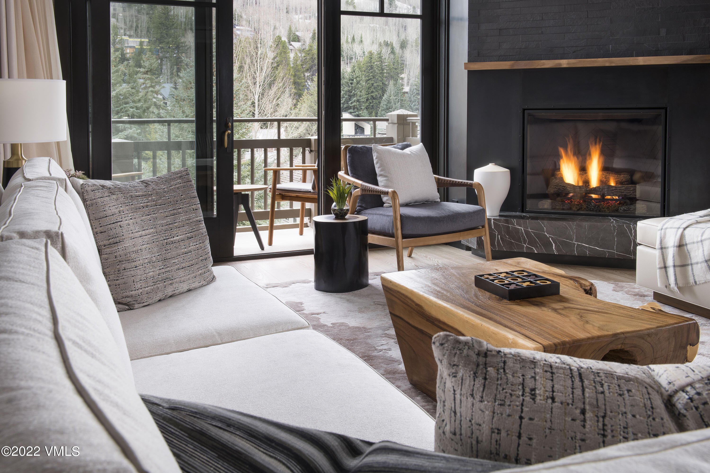 1 Vail Road, Unit 6103 Vail, CO 81657 - Photo 6 of 26 a living room with furniture and a fireplace