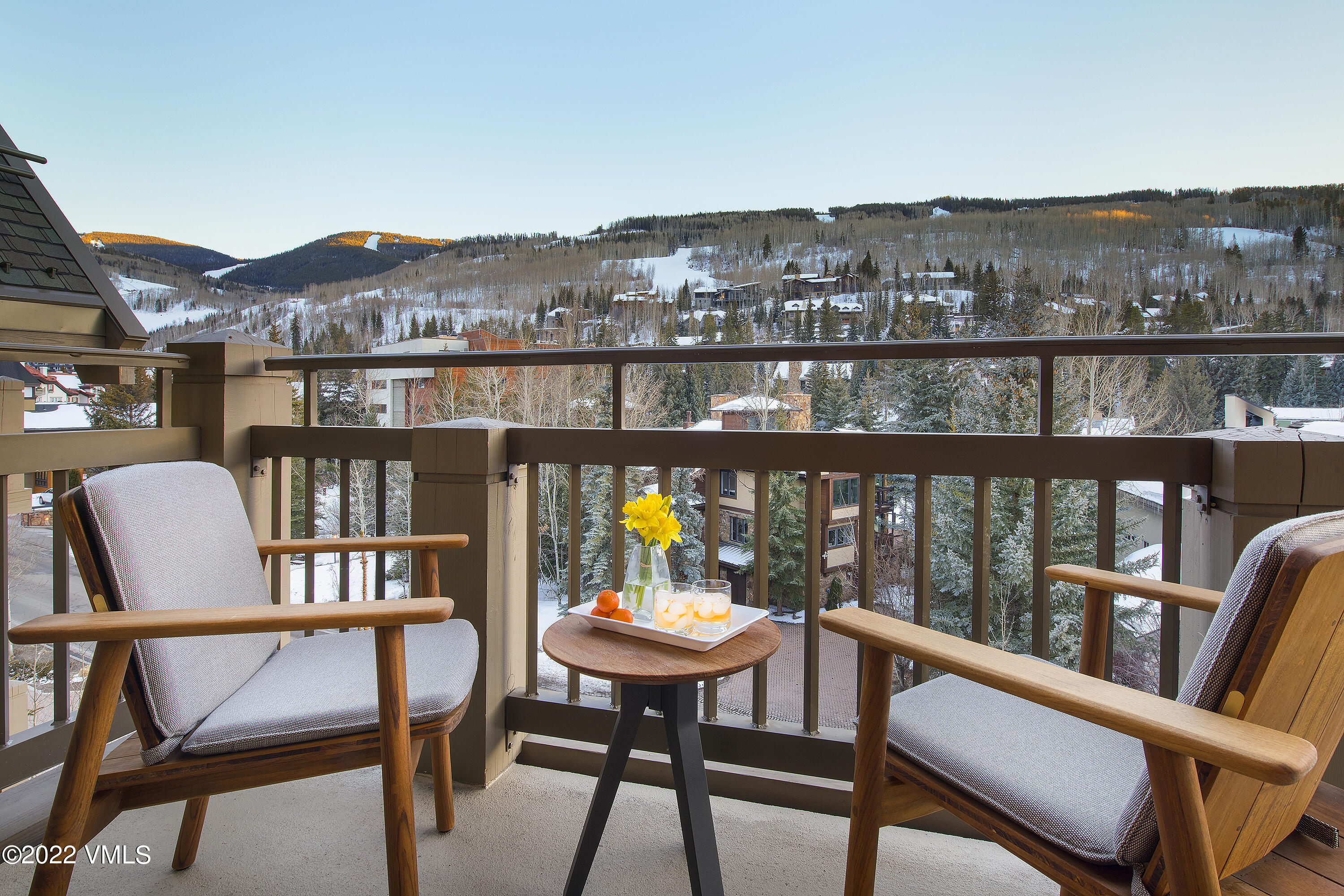 1 Vail Road, Unit 6103 Vail, CO 81657 - Photo 7 of 26 a view of a chairs and table on the roof deck