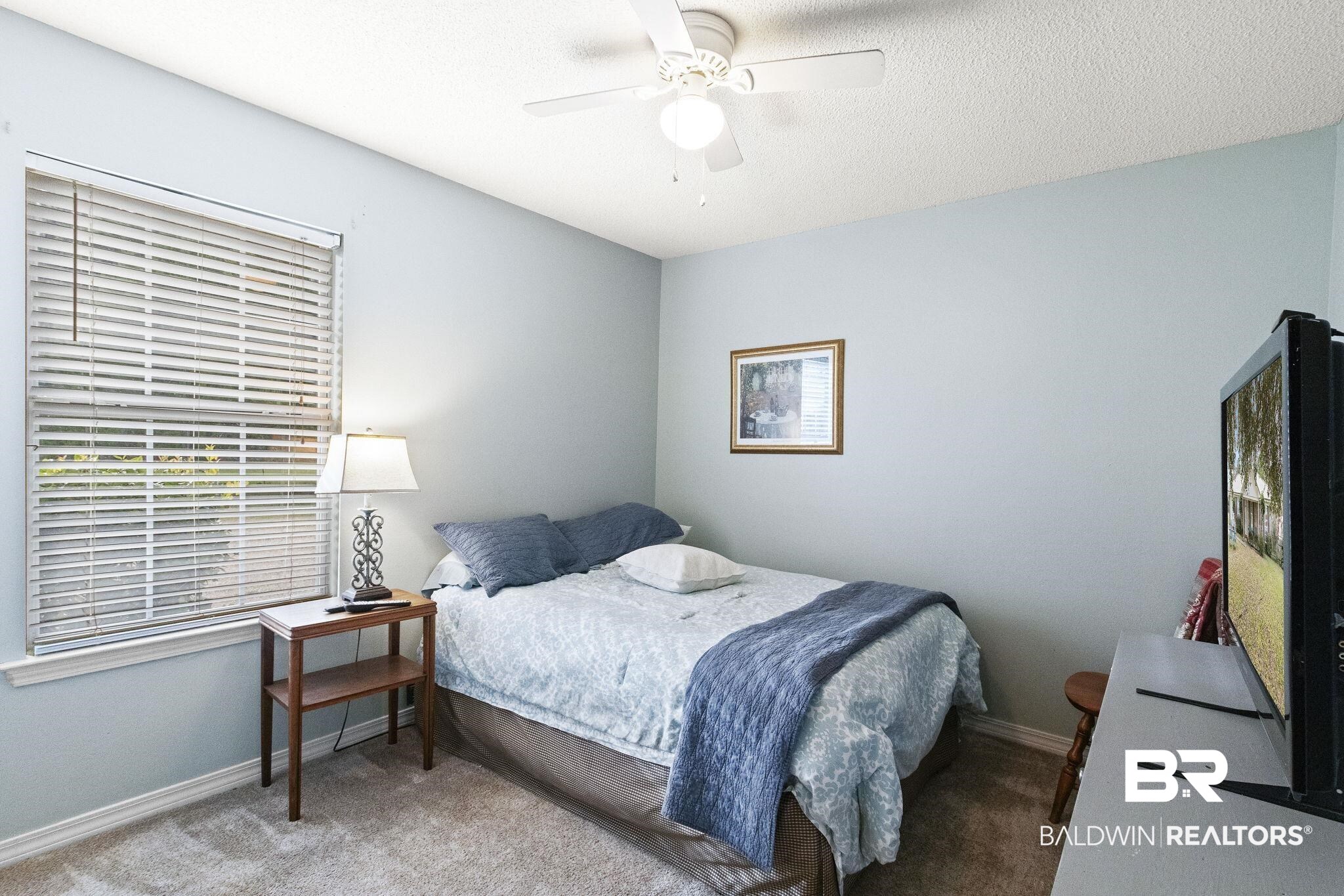 14031 Brook Hollow Road Summerdale, AL 36580 - Photo 35 of 56 Bedroom featuring carpet flooring and ceiling fan