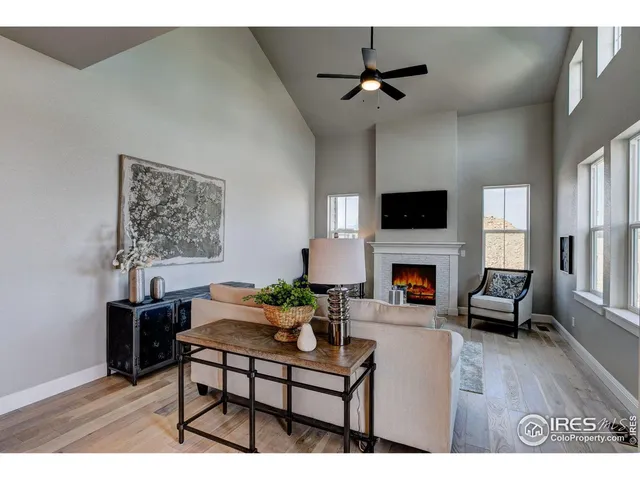 a living room with furniture fireplace and window