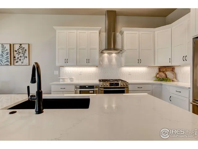 a picture of a bench in front of a wall