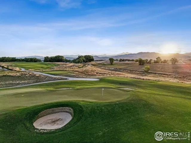 a view of a golf course with a lake