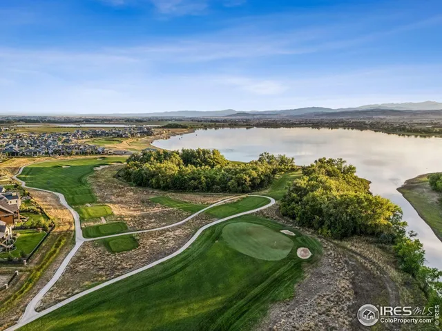 a view of a park with iron fence