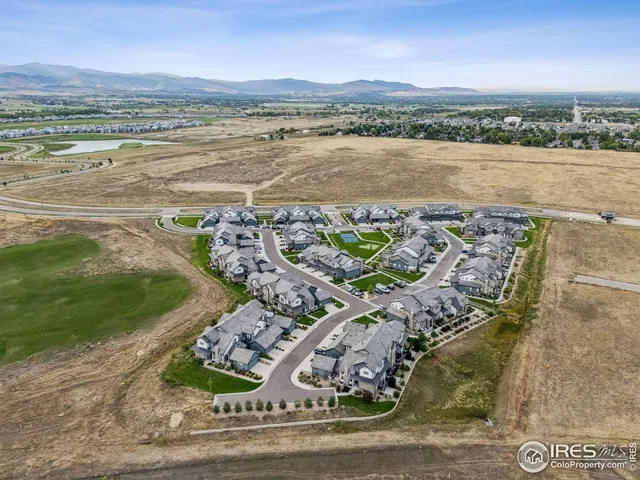 an aerial view of a house with a ocean view