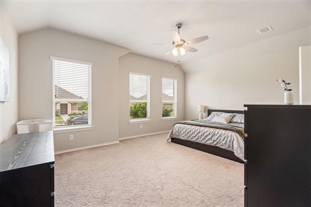 321 Pasture Drive Midlothian, TX 76065 - Photo 15 of 40 a spacious bedroom with a bed and a window