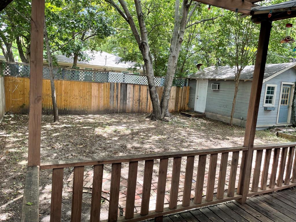 2257 College Avenue Fort Worth, TX 76110 - Photo 24 of 26 a view of a backyard with large trees