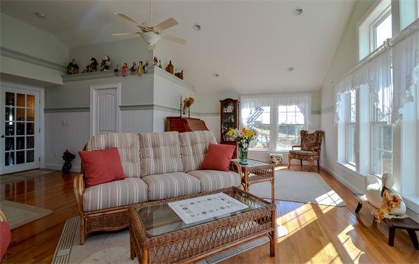273 Phillips Road Sandwich, MA 02563 - Photo 20 of 30 a living room with furniture and wooden floor