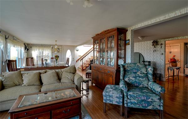 273 Phillips Road Sandwich, MA 02563 - Photo 8 of 30 a living room with furniture fireplace and a large window