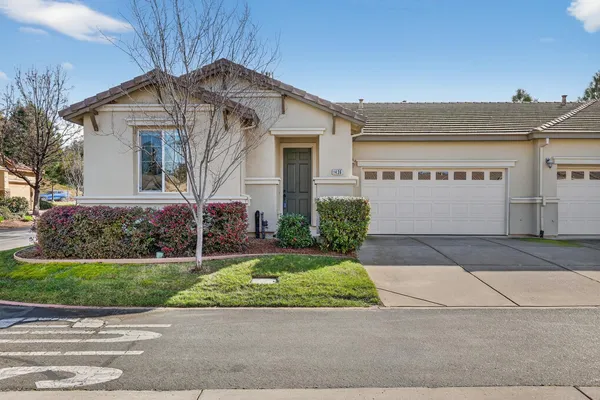 front view of a house and a garden