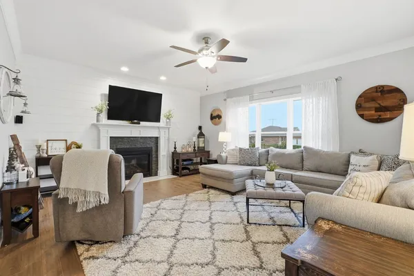 a kitchen with stainless steel appliances granite countertop a refrigerator and a dining table