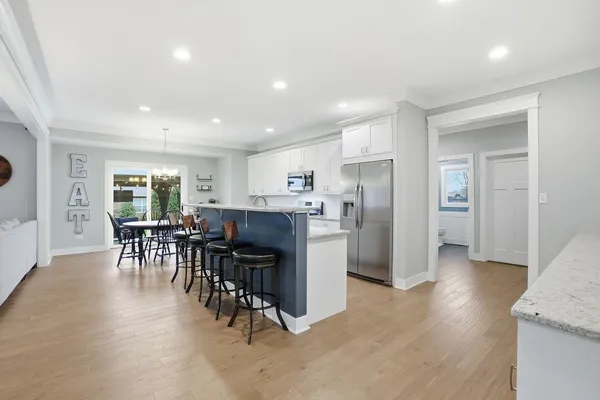 a kitchen with stainless steel appliances granite countertop a stove and a sink