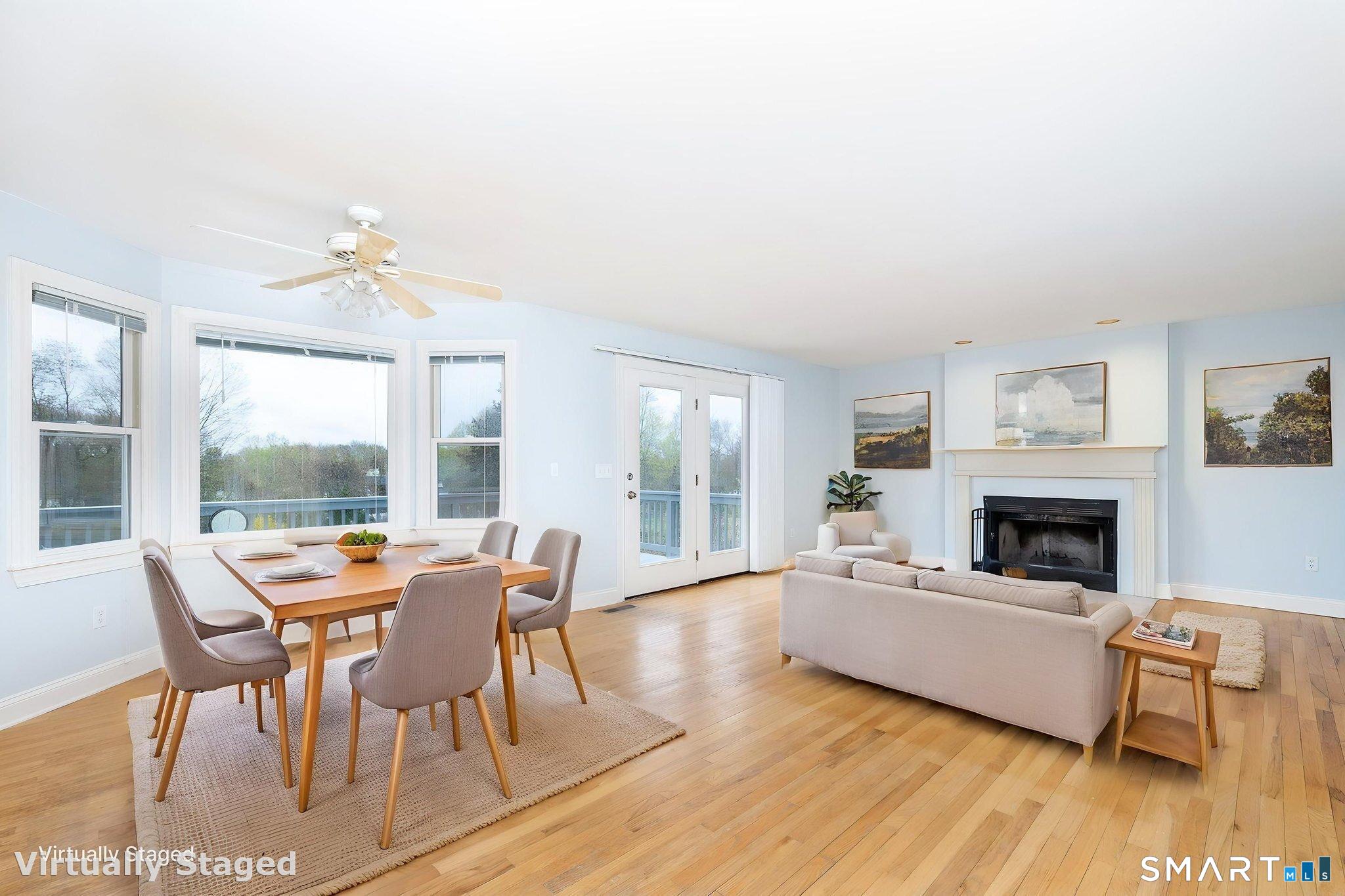 1057 Daniels Farm Road Trumbull, CT 06611 - Photo 11 of 40 a living room with furniture and a fireplace