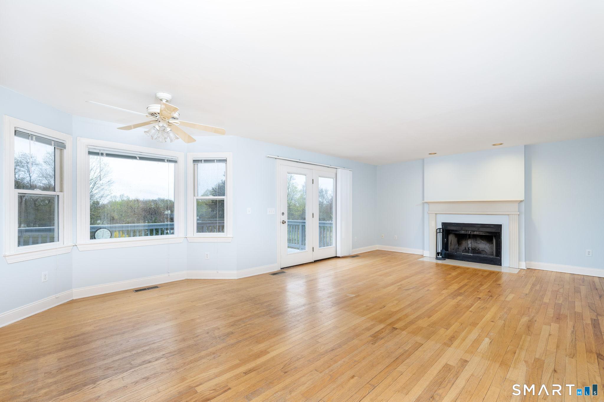 1057 Daniels Farm Road Trumbull, CT 06611 - Photo 12 of 40 a view of an empty room with a window and a fireplace