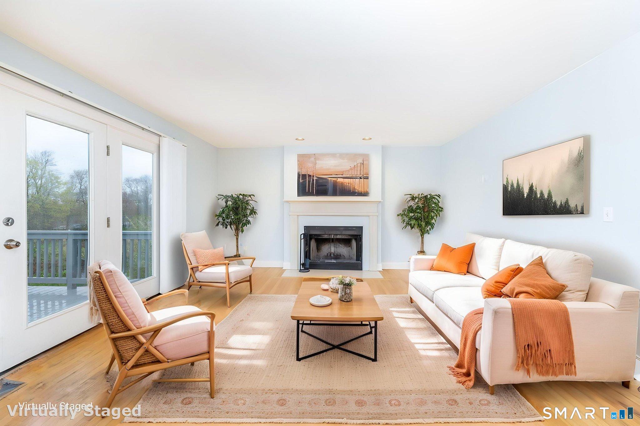 1057 Daniels Farm Road Trumbull, CT 06611 - Photo 13 of 40 a living room with furniture and a fireplace