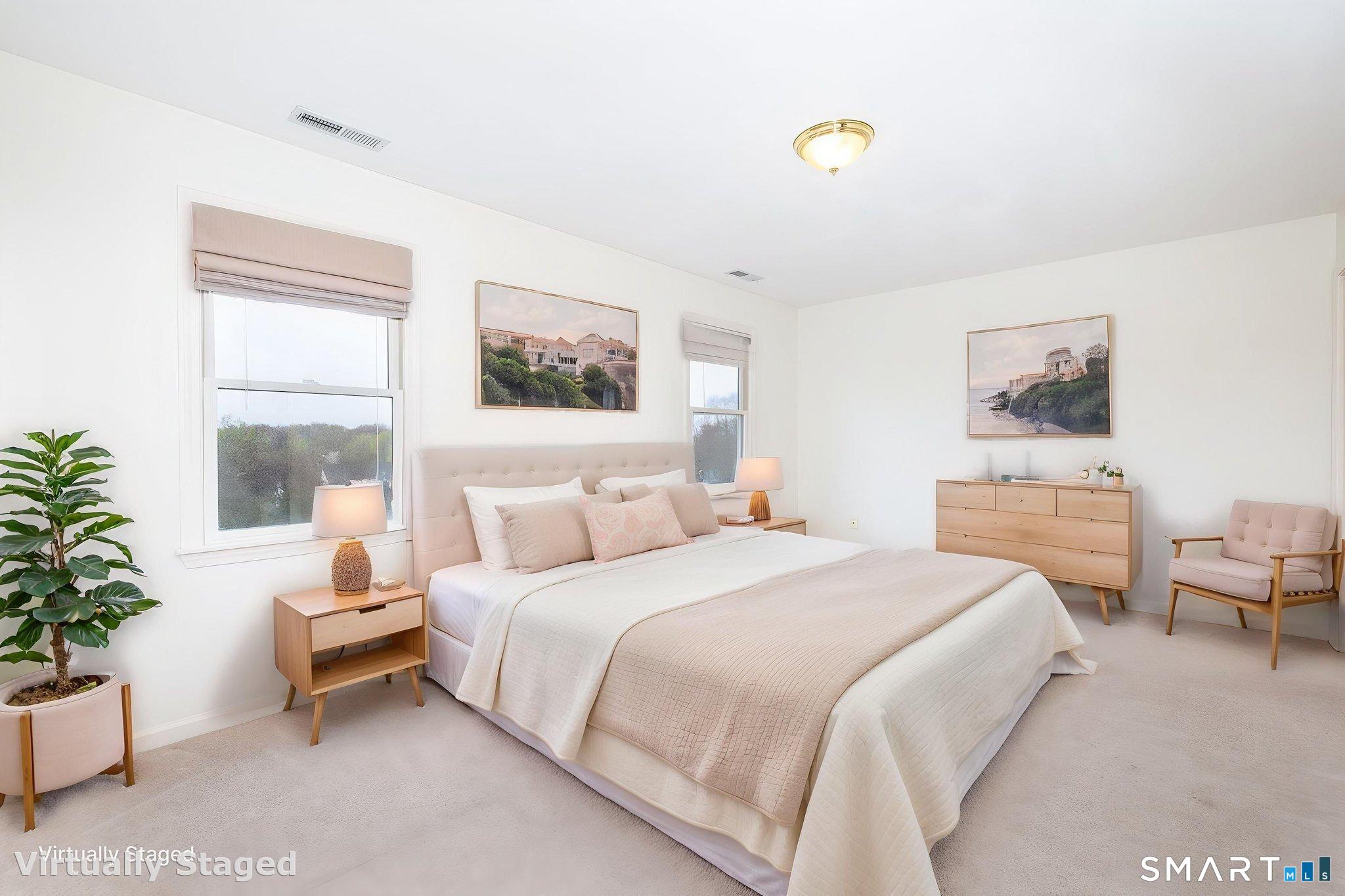 1057 Daniels Farm Road Trumbull, CT 06611 - Photo 20 of 40 a bedroom with a bed and a potted plant