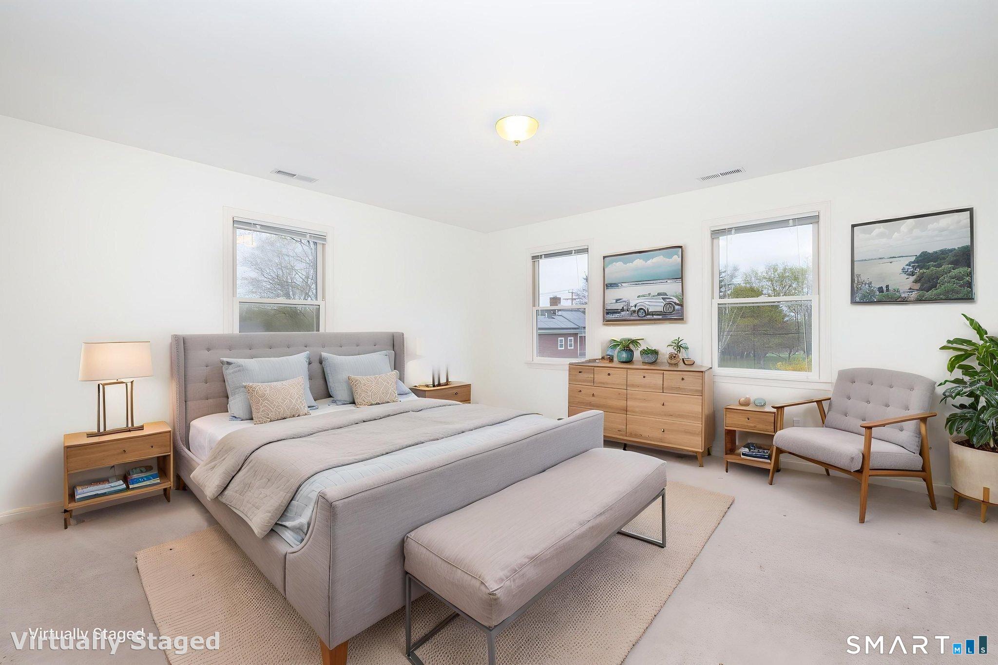 1057 Daniels Farm Road Trumbull, CT 06611 - Photo 22 of 40 a bedroom with a bed and a couch