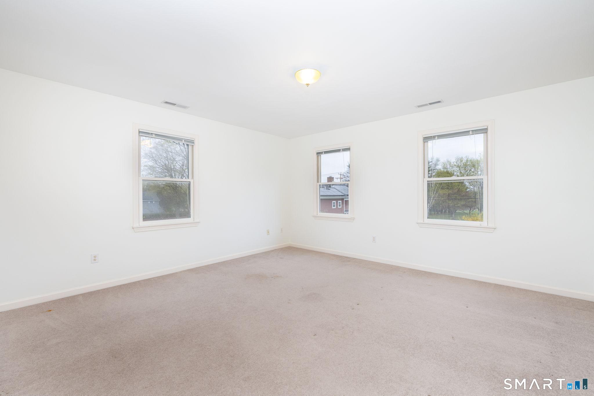 1057 Daniels Farm Road Trumbull, CT 06611 - Photo 23 of 40 an empty room with windows