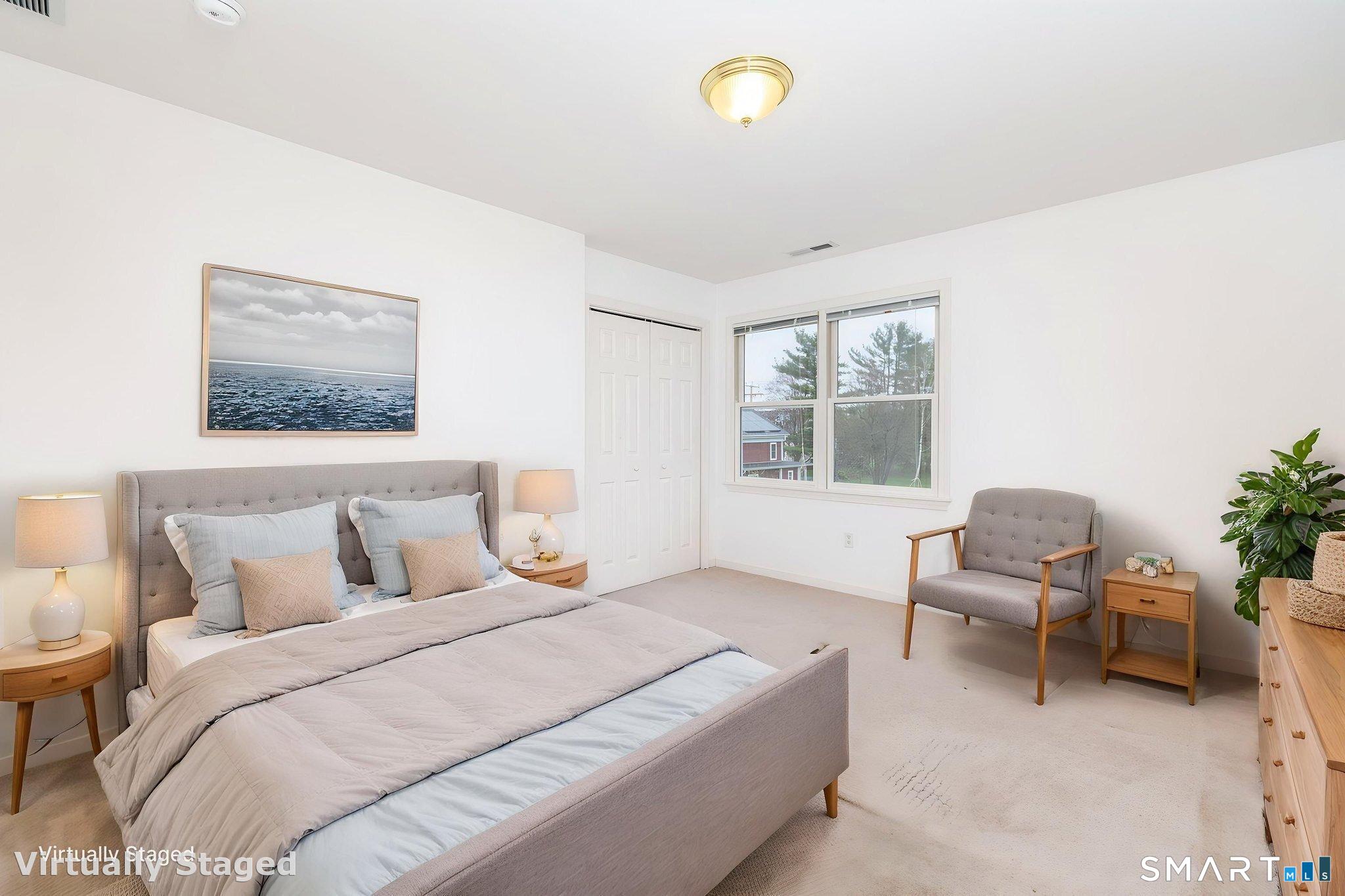 1057 Daniels Farm Road Trumbull, CT 06611 - Photo 24 of 40 a bedroom with a bed and a couch