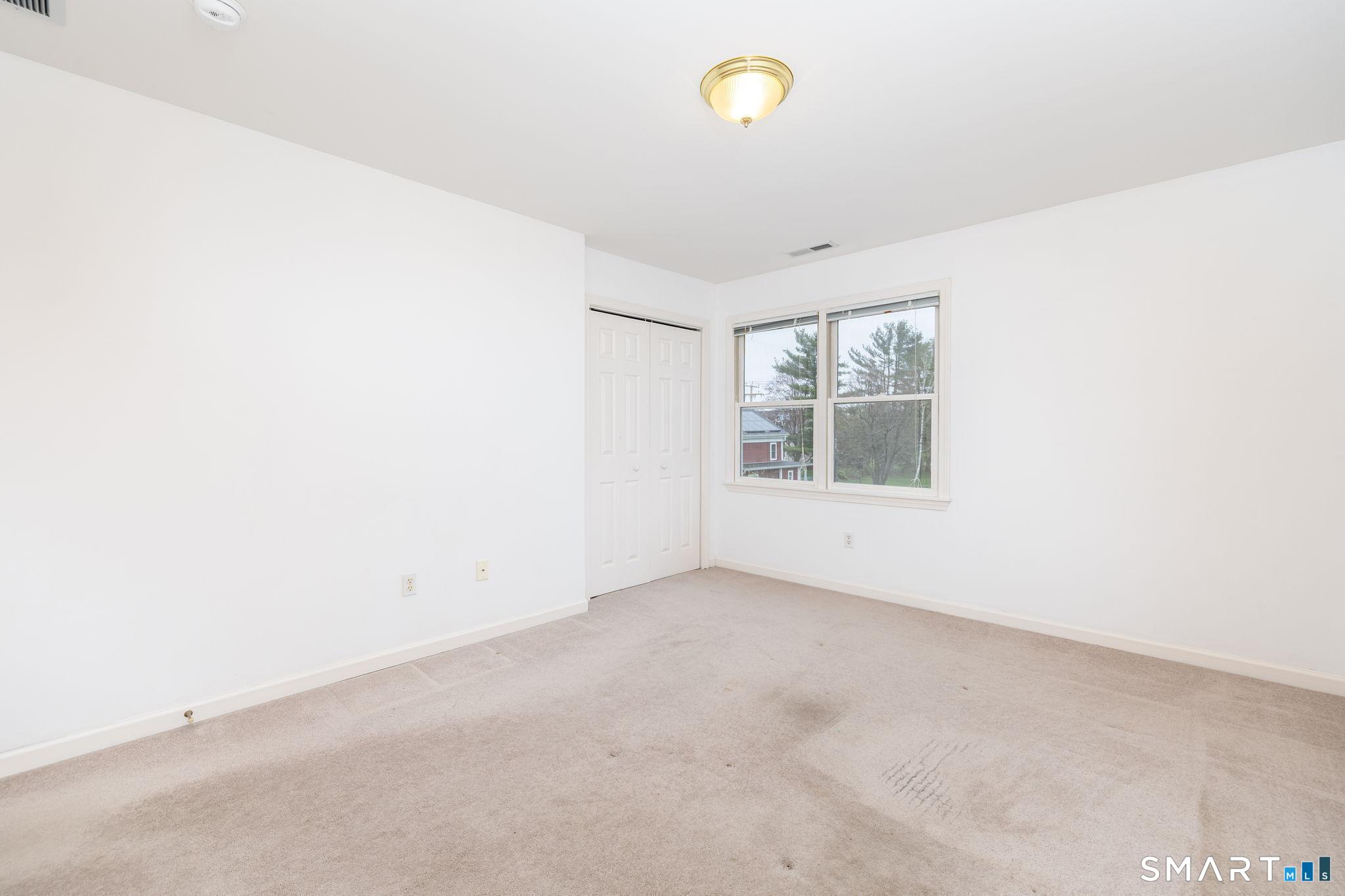 1057 Daniels Farm Road Trumbull, CT 06611 - Photo 25 of 40 an empty room with windows