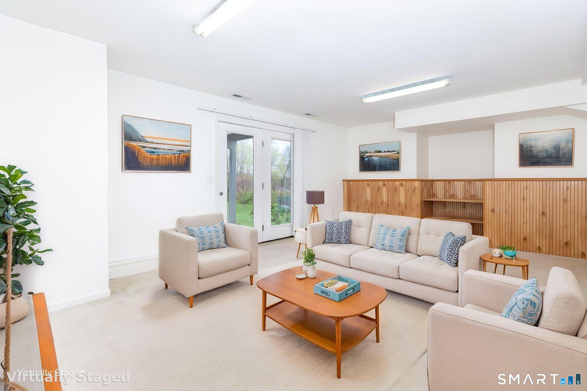 1057 Daniels Farm Road Trumbull, CT 06611 - Photo 33 of 40 a living room with furniture and a large window