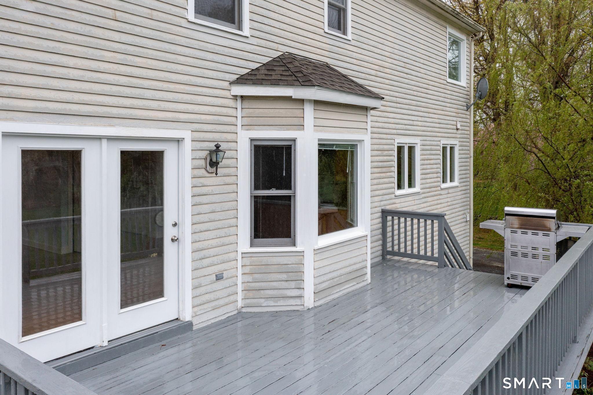 1057 Daniels Farm Road Trumbull, CT 06611 - Photo 35 of 40 a view of a house with a deck