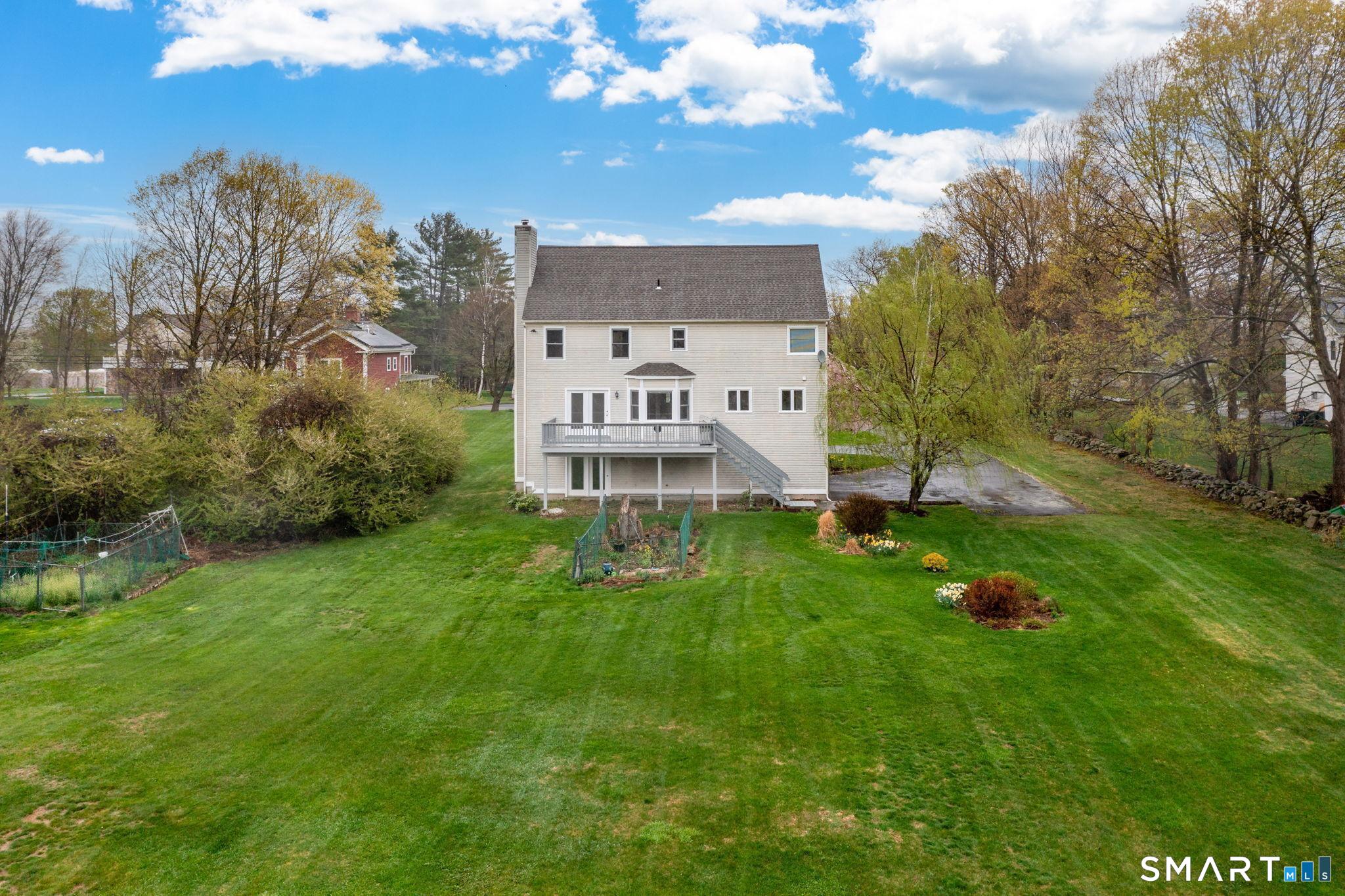 1057 Daniels Farm Road Trumbull, CT 06611 - Photo 38 of 40 a view of a house with a big yard