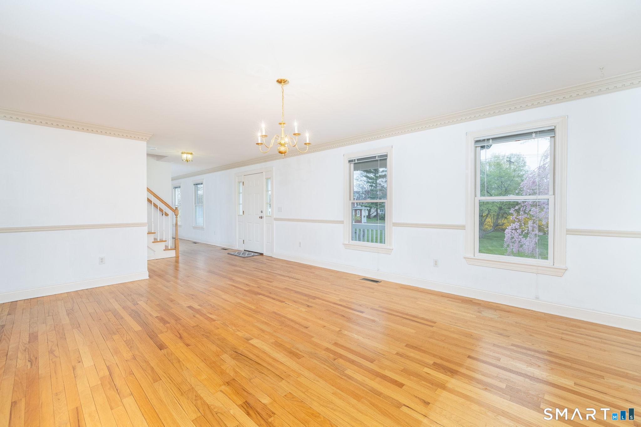 1057 Daniels Farm Road Trumbull, CT 06611 - Photo 5 of 40 a view of empty room with wooden floor