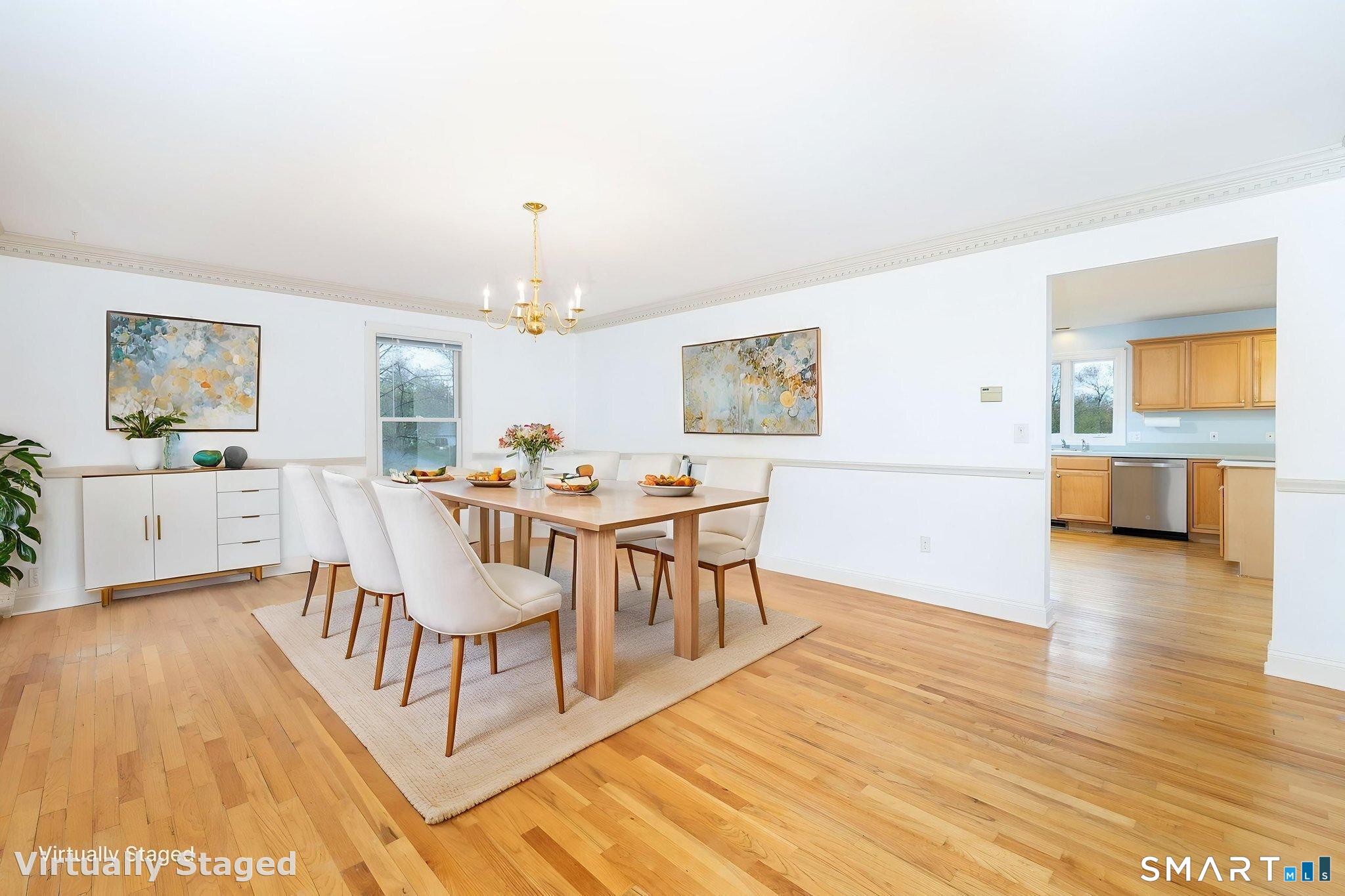 1057 Daniels Farm Road Trumbull, CT 06611 - Photo 6 of 40 a living room with furniture and a wooden floor