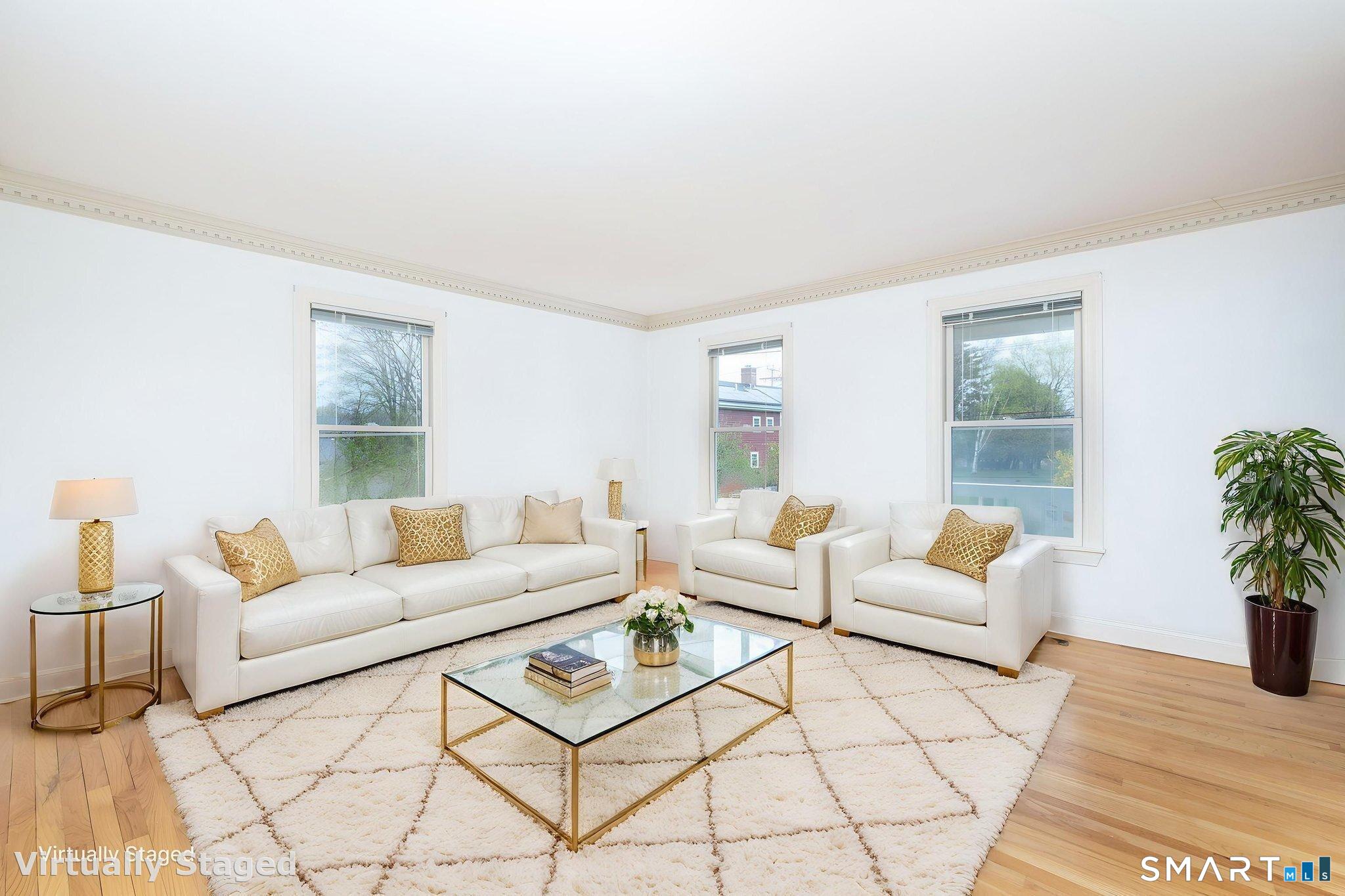 1057 Daniels Farm Road Trumbull, CT 06611 - Photo 7 of 40 a living room with furniture and a potted plant