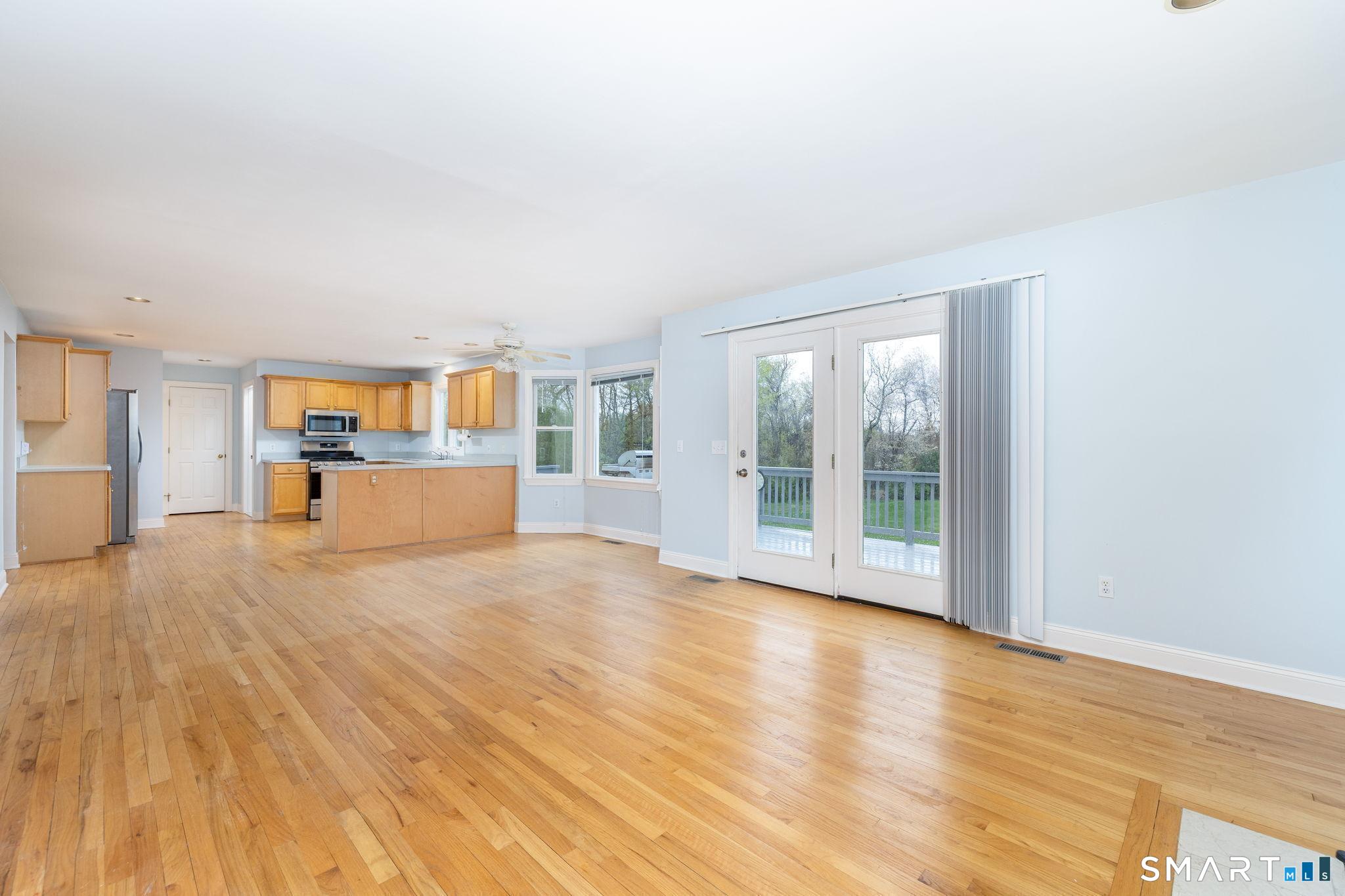 1057 Daniels Farm Road Trumbull, CT 06611 - Photo 10 of 40 a view of wooden floor and windows in a room
