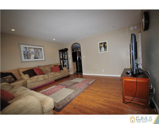 33 Sturgis Road Edison, NJ 08817 - Photo 2 of 10 a living room with furniture and a flat screen tv