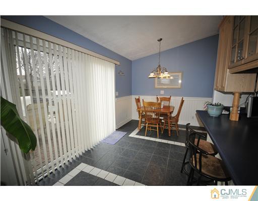 33 Sturgis Road Edison, NJ 08817 - Photo 4 of 10 a view of a dining room with furniture and chandelier