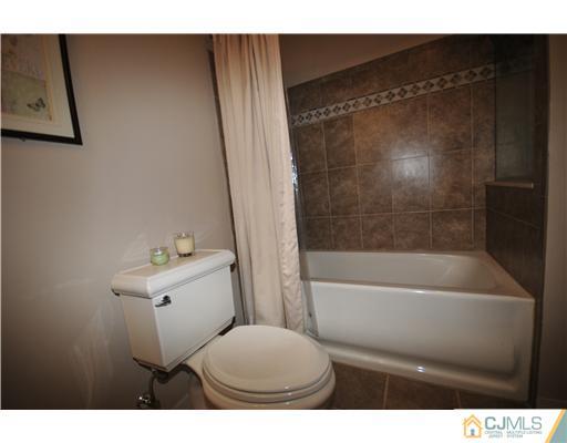 33 Sturgis Road Edison, NJ 08817 - Photo 5 of 10 a bathroom with a toilet and a bathtub