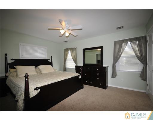 33 Sturgis Road Edison, NJ 08817 - Photo 6 of 10 a living room with furniture and a chandelier