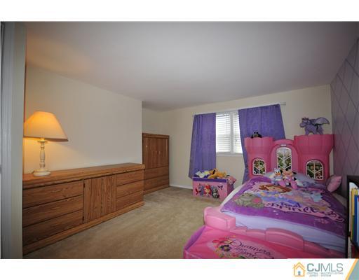 33 Sturgis Road Edison, NJ 08817 - Photo 7 of 10 a bedroom with a bed and window