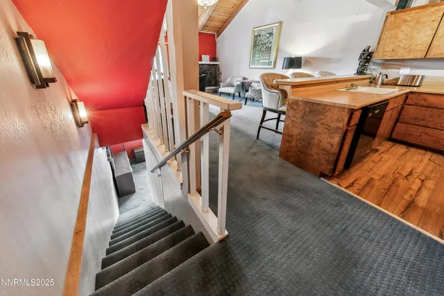 a view of living room kitchen and entryway