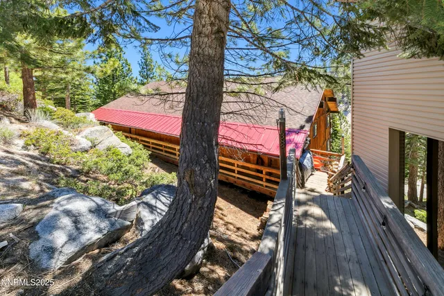 a view of a two chairs in the balcony