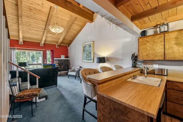 a room with pool table and windows