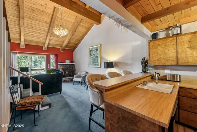 a room with pool table and windows