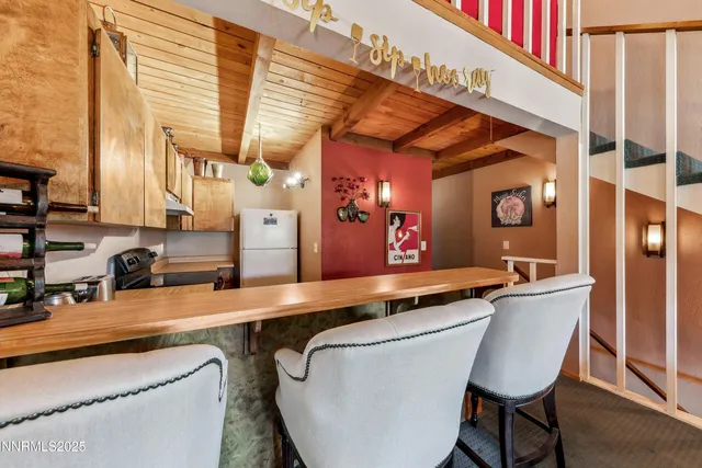 a dining table chair next to a window