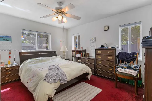 a bed room with a bed and a dresser