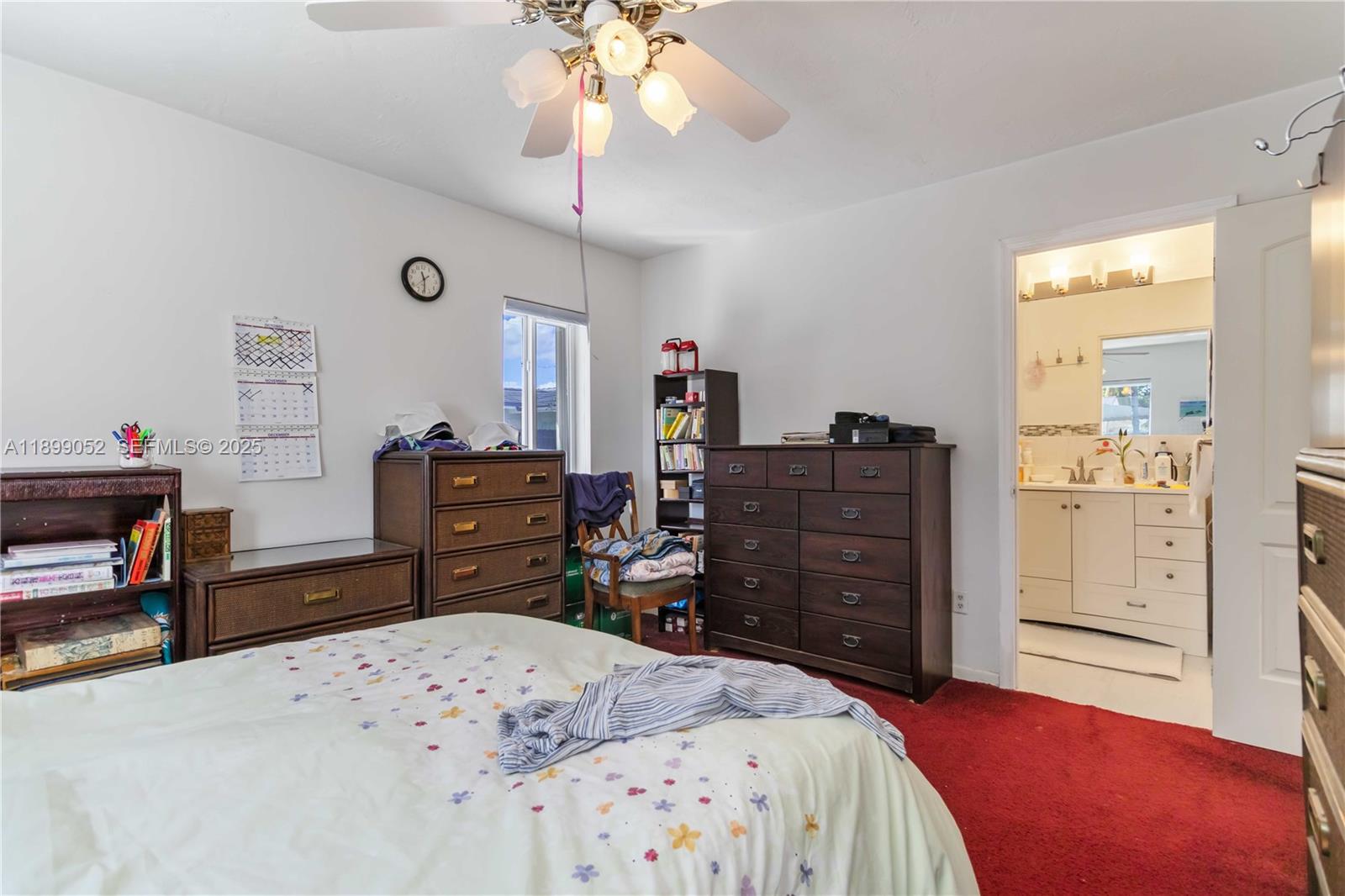 12410 Southwest 106th Terrace Miami, FL 33186 - Photo 15 of 27 a bed room with a bed and a dresser