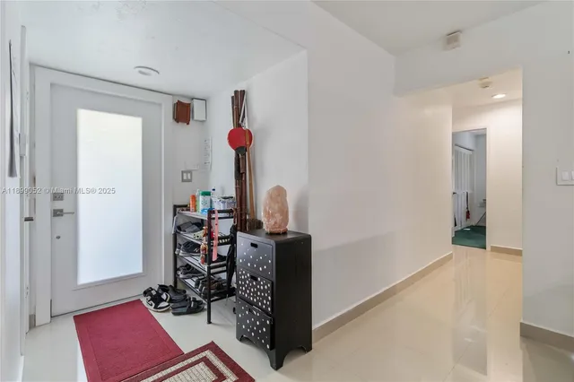 a living room with furniture a flat screen tv and a flat screen tv