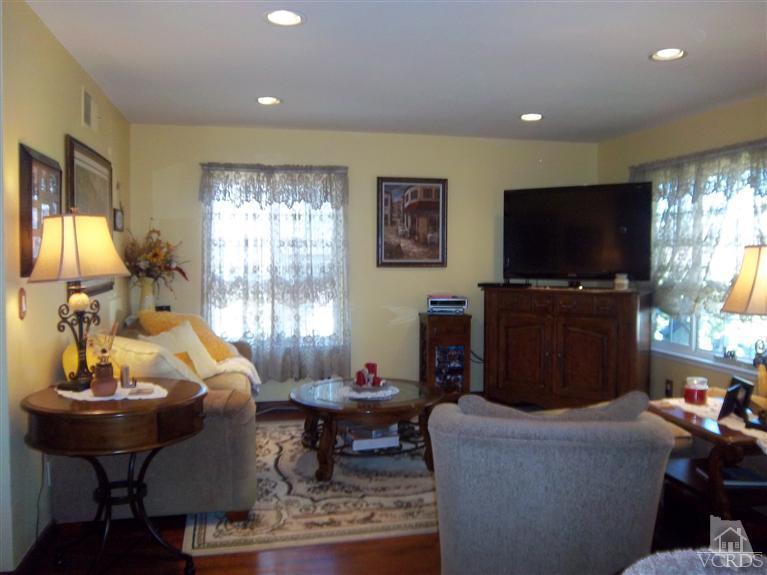 13520 East Quail Summit Road Moorpark, CA 93021 - Photo 3 of 20 a living room with furniture and a flat screen tv