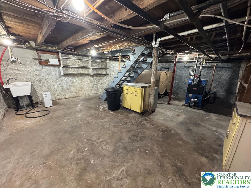 868 Catawissa Road Tamaqua, PA 18252 - Photo 51 of 67 A utilitarian basement provides ample storage and houses essential home systems.