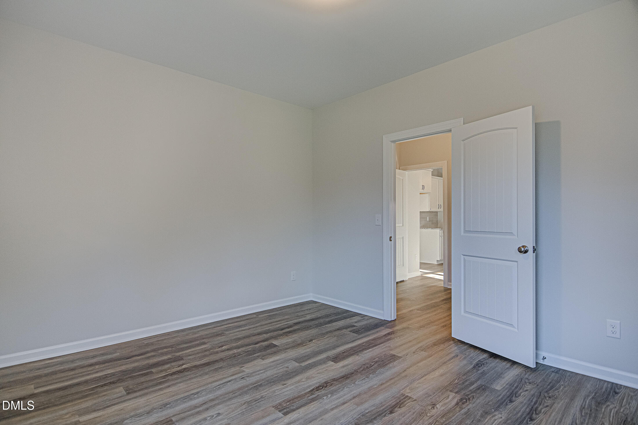 108 Starlet Ridge Way Clayton, NC 27520 - Photo 14 of 37 a view of wooden floor and windows in a room